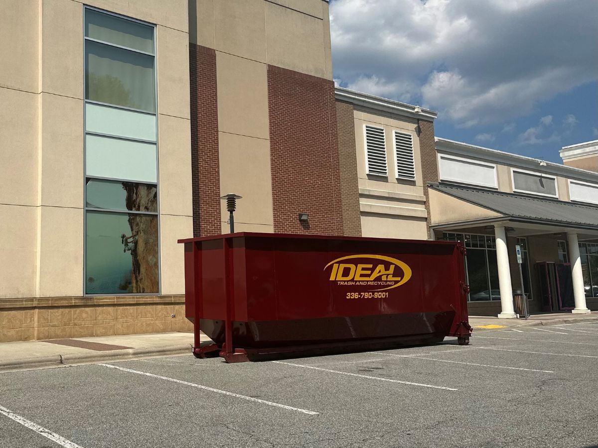 IDEAL Dumpster in front of a commercial building